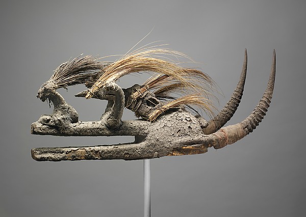 Kòmò Helmet Mask, 19th–mid-20th century, West Africa, Komo or Koma Power Association, Wood, bird skull, porcupine quills, horns, cotton, sacrificial materials, 35.2 x 22.1 x 85.6 cm (The Metropolitan Museum of Art)