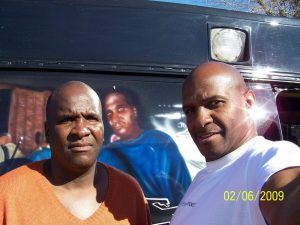 ld and arthur reed in front of Stop the Violence van
